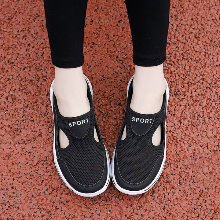 A pair of neutral-toned orthopedic house slippers, offering arch support for men's and women's foot comfort.