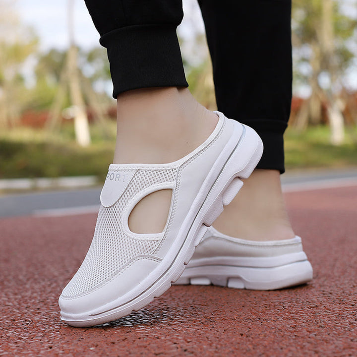 Detailed shot of the supportive arch in these cozy, non-slip orthopedic house slippers for foot comfort.