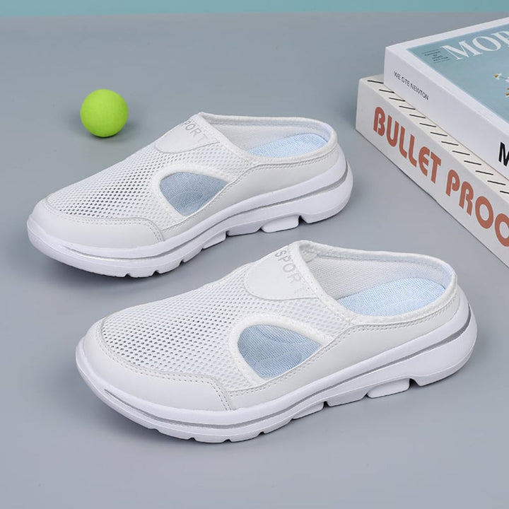 Soft, slip-on unisex orthopedic house slippers designed for maximum arch support and cozy indoor foot comfort.