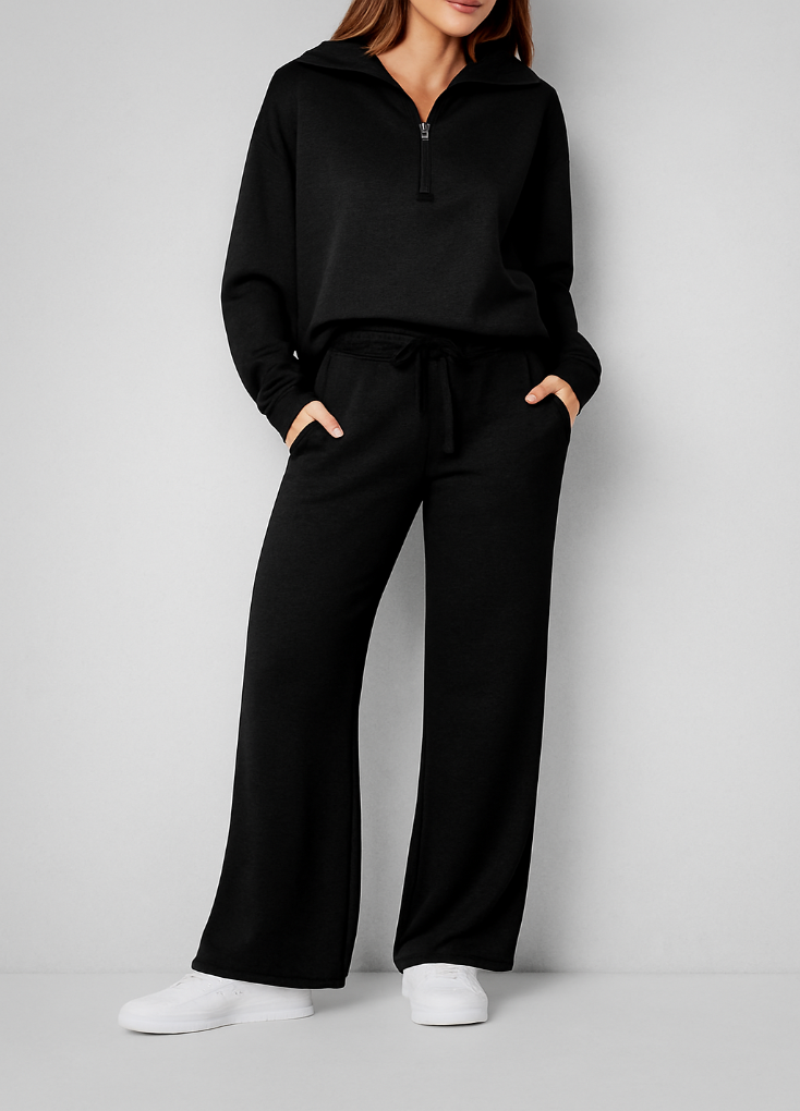 Soft & cozy women's 2-piece lounge set made from a synthetic blend, including a quarter-zip and comfortable wide-leg pants.