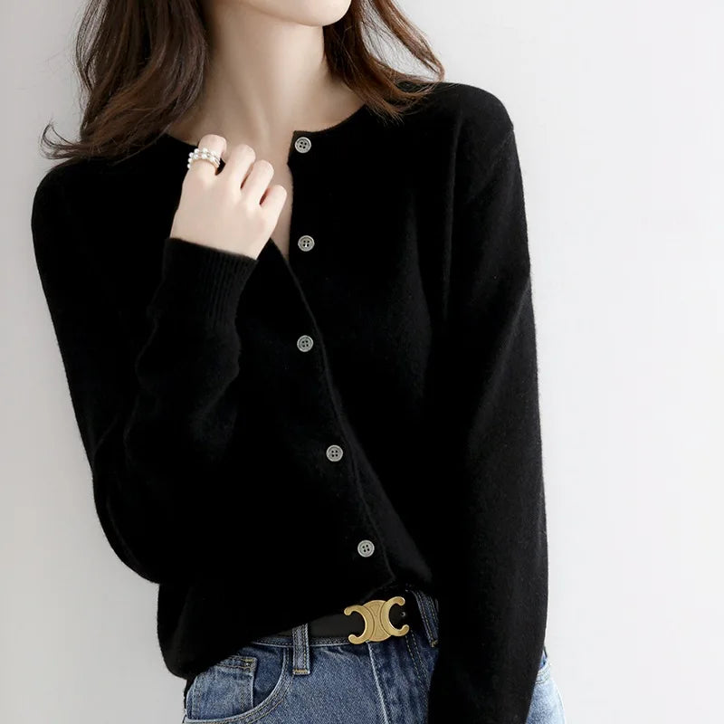 Cozy women's button-up cardigan sweater in soft knit, ideal for everyday elegance & warmth in winter fashion.