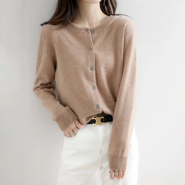 Elegant women's button-up cardigan, perfect for layering casual or winter fashion outfits. A chic women's sweater.