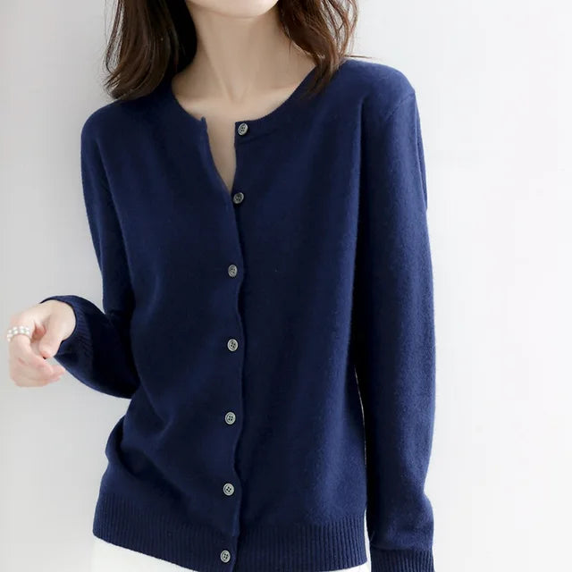 Versatile women's button-up cardigan sweater, ideal for layering and adding cozy style to any elegant outfit.