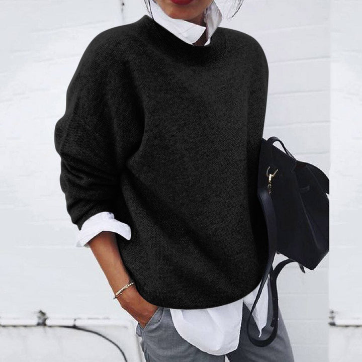 Relaxed fit women's long sleeve mock neck jumper. Oversized sweater offers comfortable, casual winter fashion.