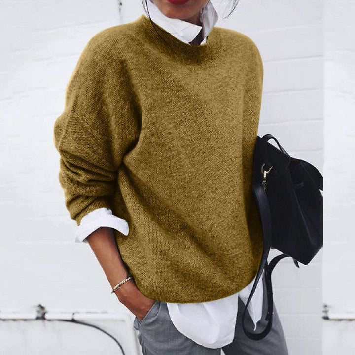 Soft knit women's oversized mock neck long sleeve sweater. Cozy jumper for comfortable fall & winter everyday wear.