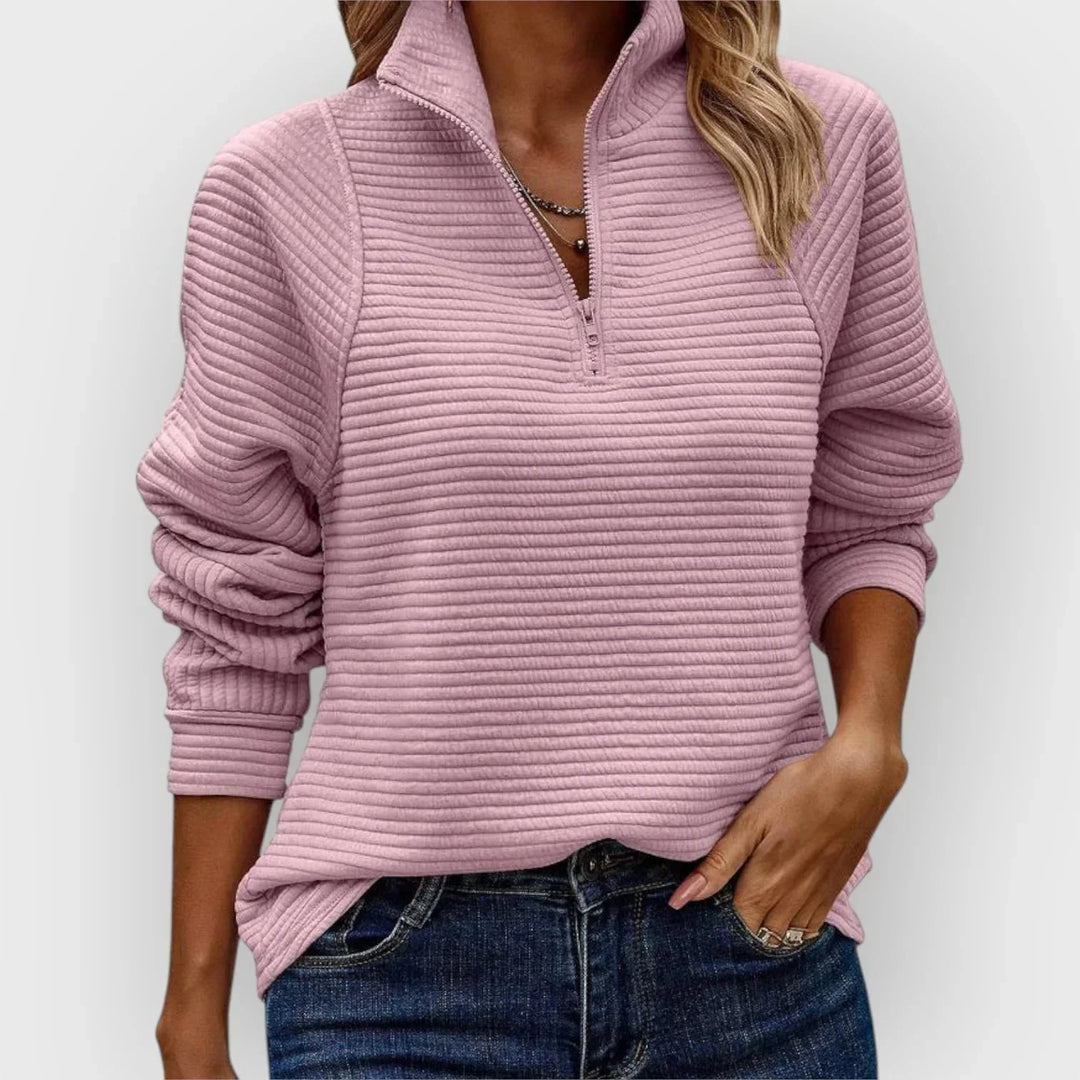 Cozy women's pink ribbed knit half-zip sweater with stand-up collar, perfect for fall and winter style.