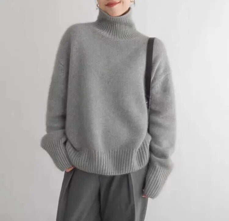 Cozy women's soft knit turtleneck sweater in a relaxed fit, perfect for elegant winter and fall outfits.