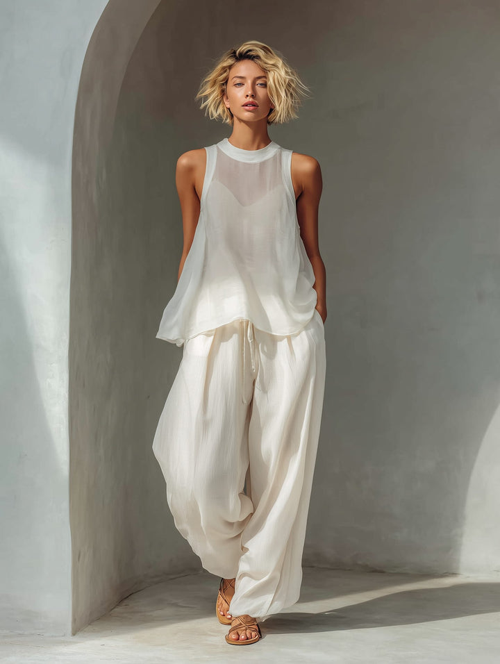 Women's cream chiffon wide leg trousers with adjustable drawstring waist. Ideal for summer casual & vacation.