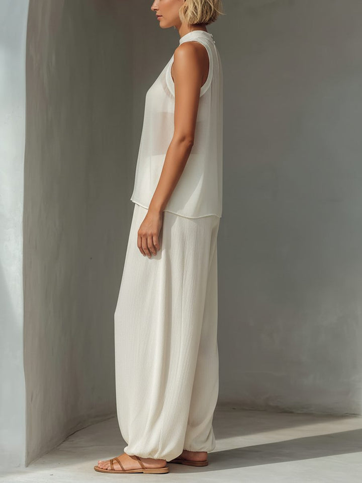 Flowy cream chiffon wide leg trousers set for women. Relaxed drawstring waist & sleeveless top, great for vacation.