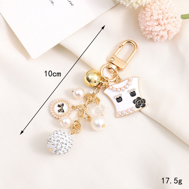 Adorable bear charm keychain featuring a heart & a jingling bell, great cute gift idea.