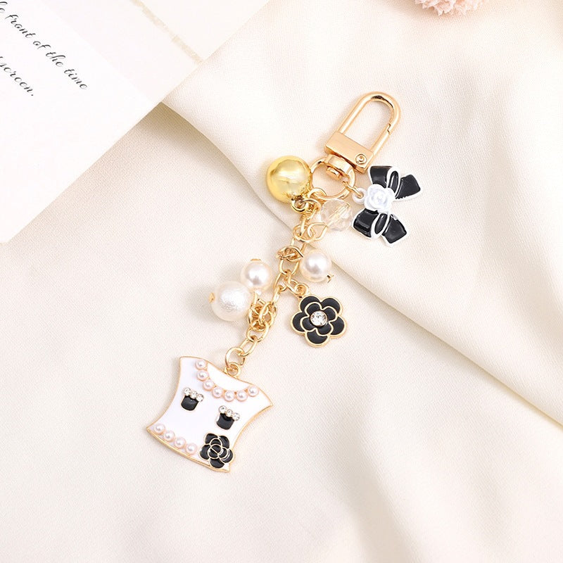 Gift-ready bear heart keychain with a delicate bell, a cute bag accessory or key holder.