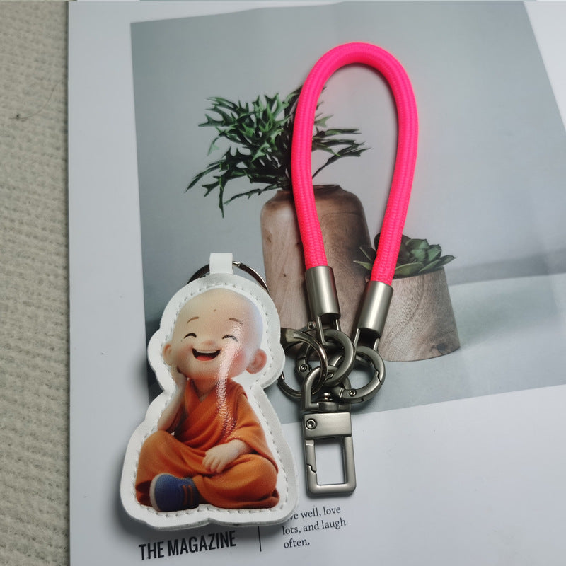Cartoon character bag charm attached to a backpack, vibrant & cute accessory.