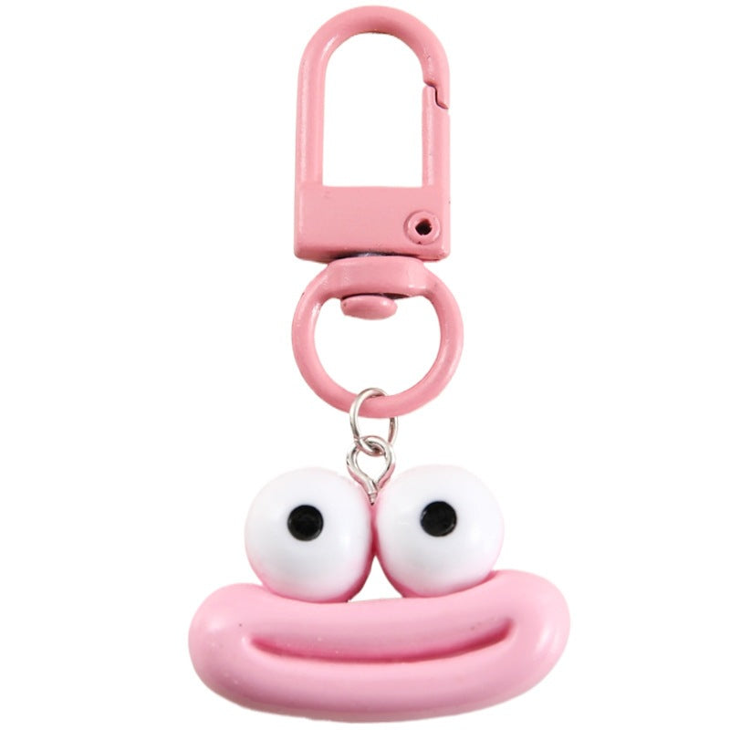 Cute cartoon face keychain, a vibrant accessory for bags & keys. Perfect unisex gift idea.