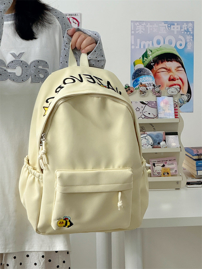 Adorable cartoon school backpack, unisex & colorful, featuring a playful design for young students.