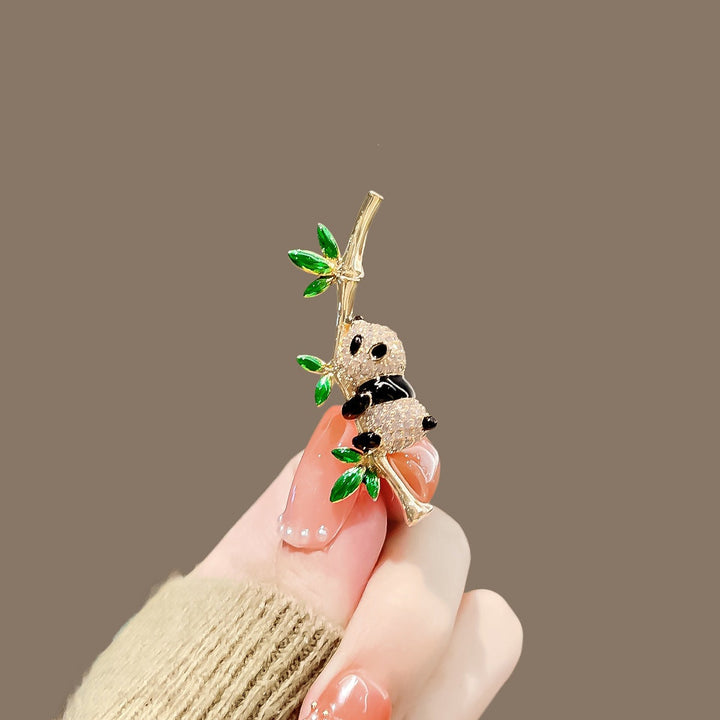Cute enamel panda brooch pin, perfect animal lover's accessory.