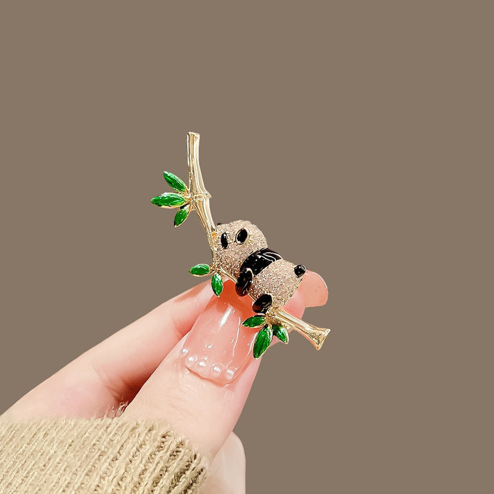 Playful black and white panda pin, a charming jewelry gift for animal enthusiasts.