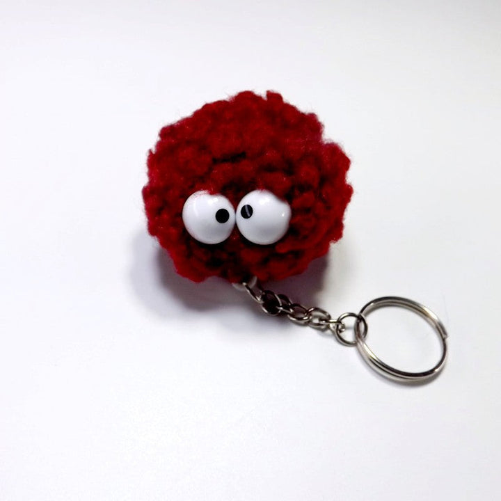Playful fabric character keychain with cute eyes. A unique unisex bag accessory and gift.