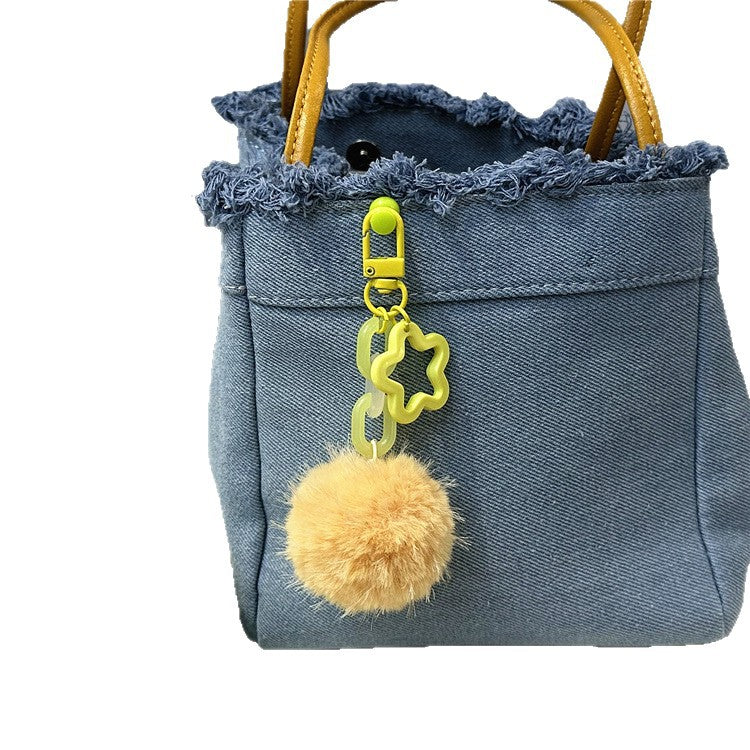 Women's cute fuzzy pom-pom keychain. Playful bag charm accessory.