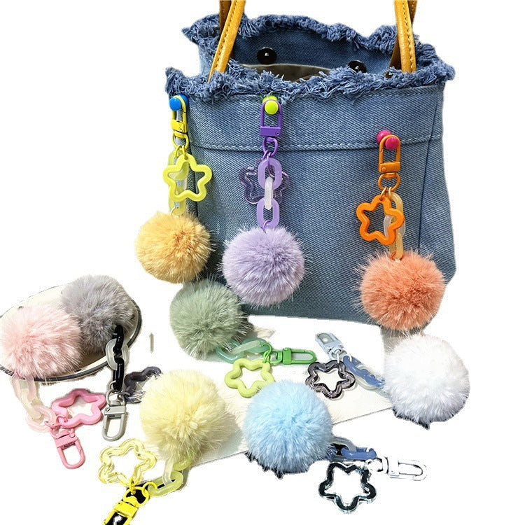 Colorful fuzzy pom-pom keychain, a soft bag charm accessory for women.
