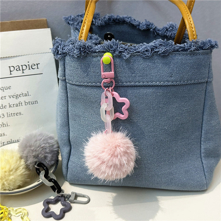 Cute fuzzy pom-pom keychain. Soft, playful, and colorful women's bag accessory.