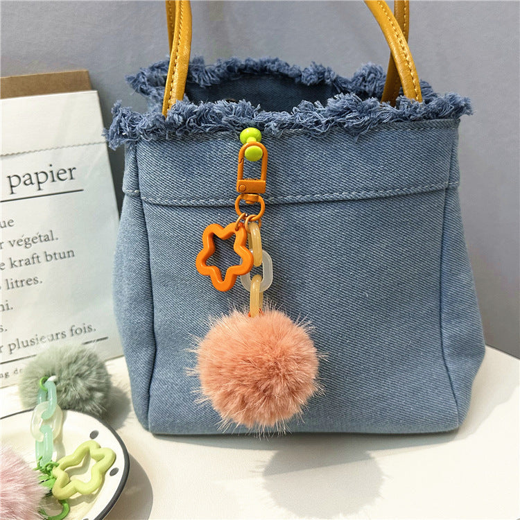 Soft and cute fuzzy pom-pom keychain. Perfect women's bag charm accessory.
