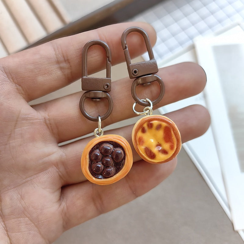Cute miniature chocolate cake keychain for bags, backpacks, & keys. Adorable sweet accessory & gift.
