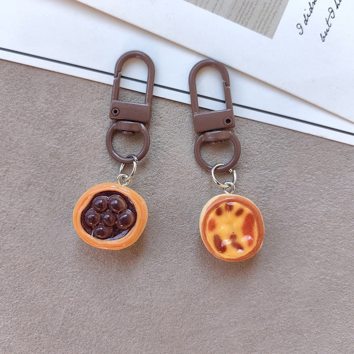 Adorable dessert cake design keychain with sweet chocolate frosting & details. Perfect cute bag charm.