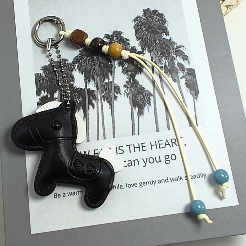 Charming blue cat keychain in synthetic leather, a cute accessory for bags, purses, or organizing keys.