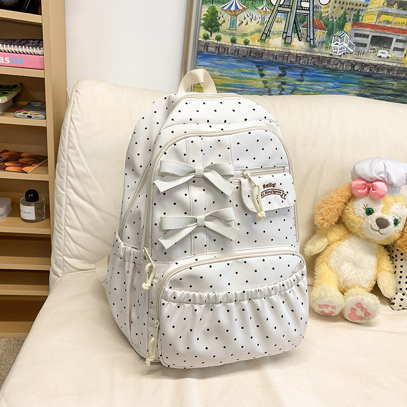 Cute pink polka dot girls' school backpack with a charming bow, durable and lightweight student bag.