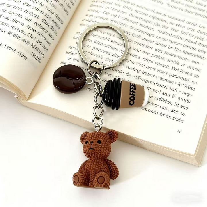 Cute playful bear and drink keychain charm. Perfect bag accessory or gift idea for animal lovers.