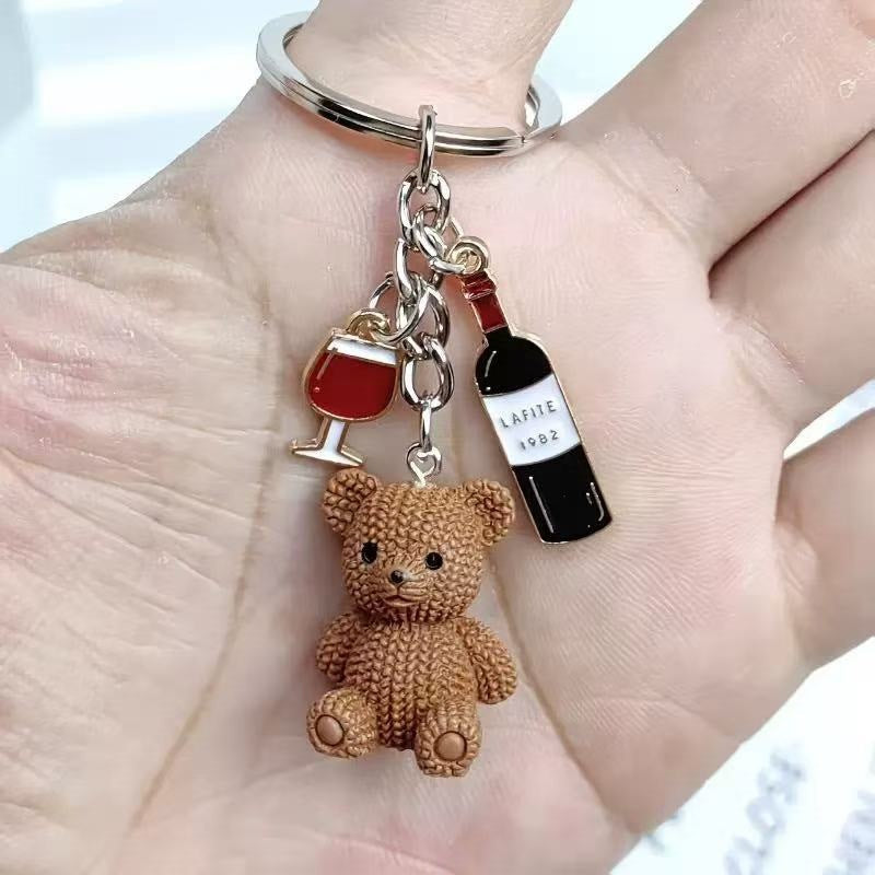 Super cute playful bear & drink key charm. Fun bag accessory, great gift for those who love animal designs.