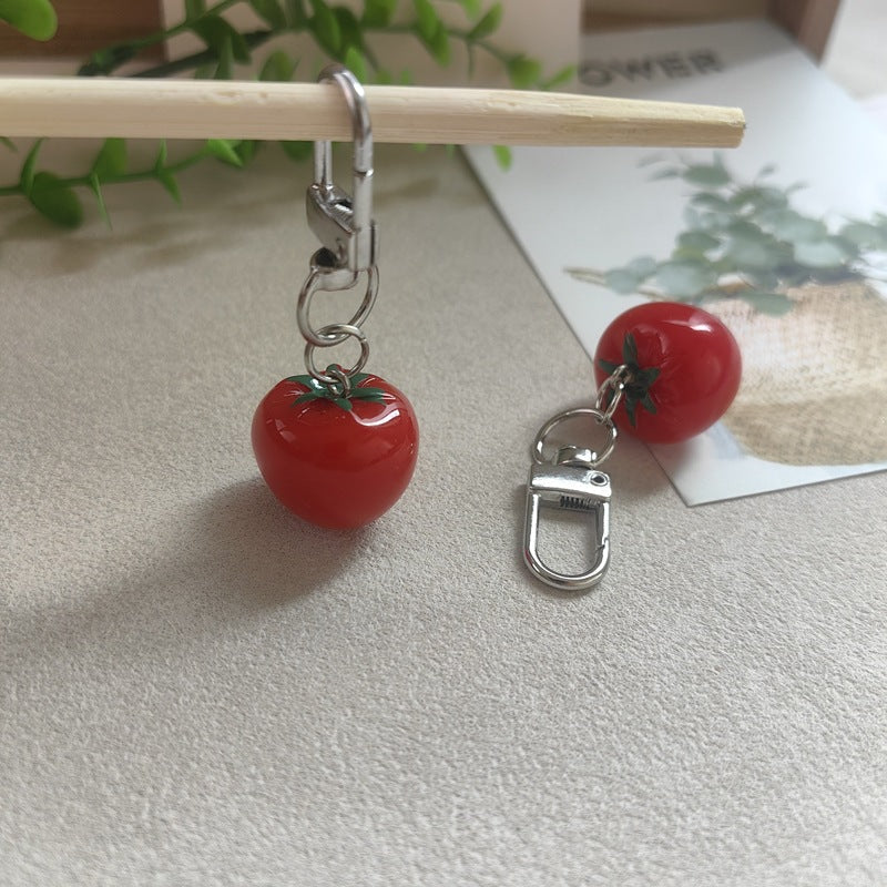Adorable plastic tomato novelty keychain, adds a pop of color to any bag or set of keys.