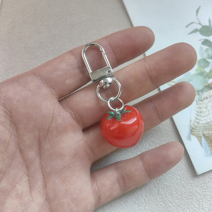 Sweet red tomato key accessory, a charming and practical addition for keys or bags.