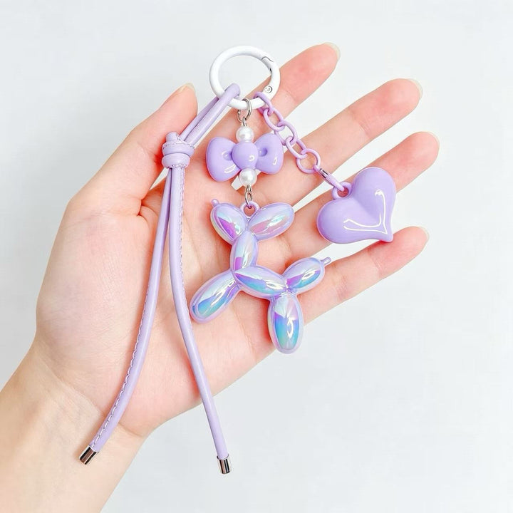 Stylish heart and balloon dog keychain charm, a versatile accessory for any bag or keys.
