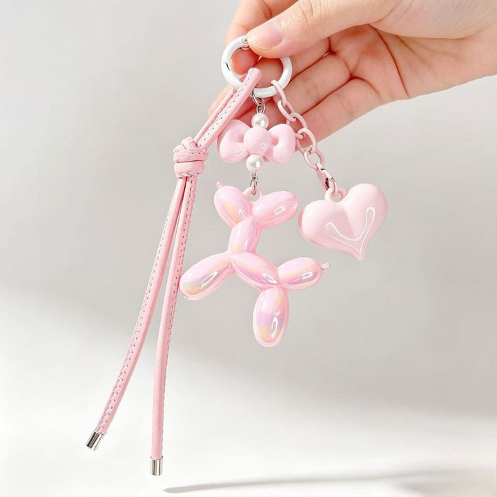 Playful resin balloon dog & heart charm, a vibrant keychain accessory for all ages.
