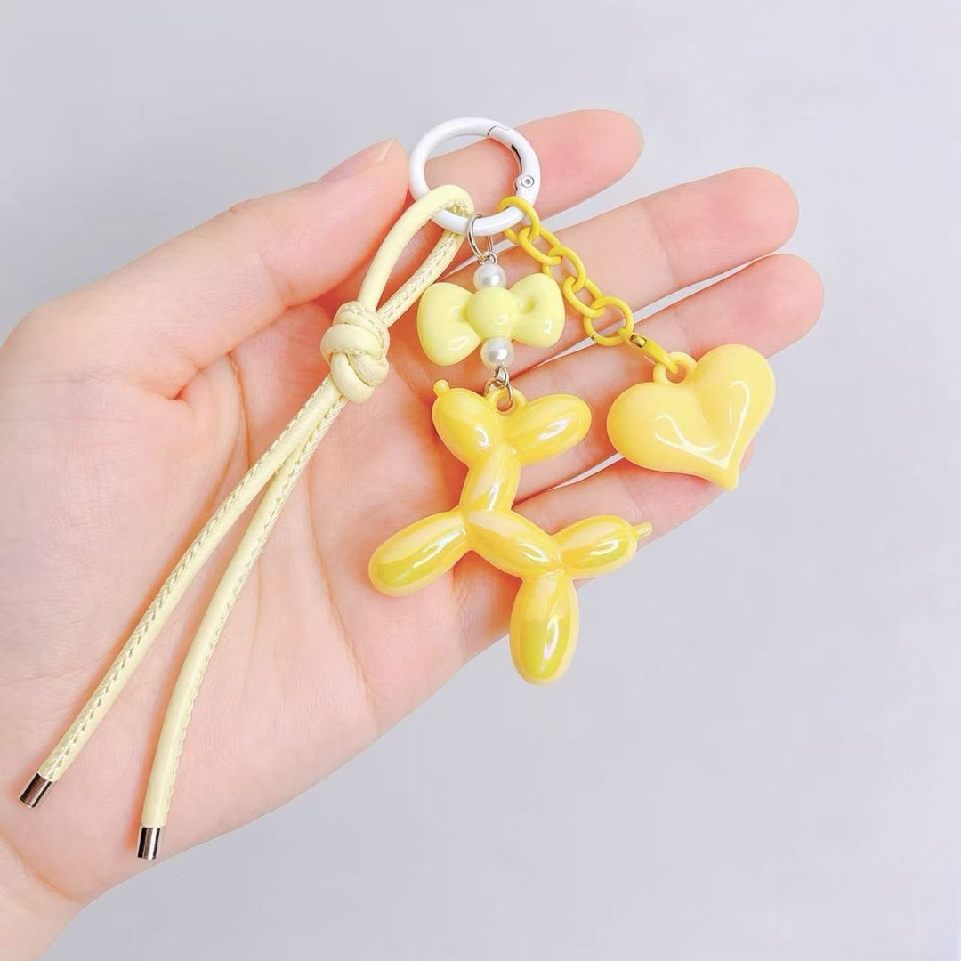 Charming heart and balloon dog design keychain, ideal for personalizing bags or keys.