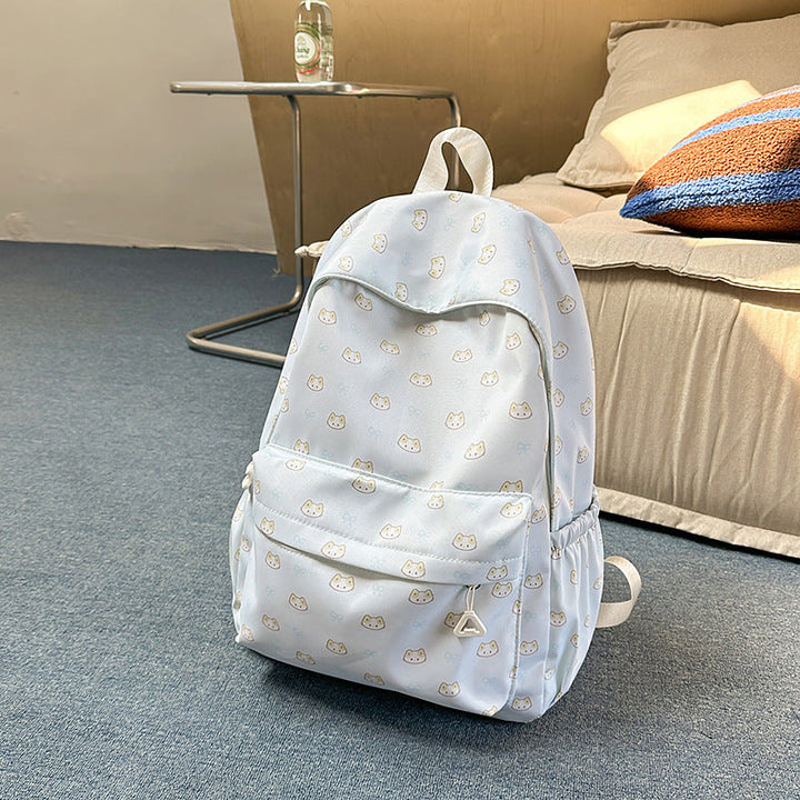 Playful cartoon cat design school backpack in brown. Cute unisex travel bag, perfect for kids and students.