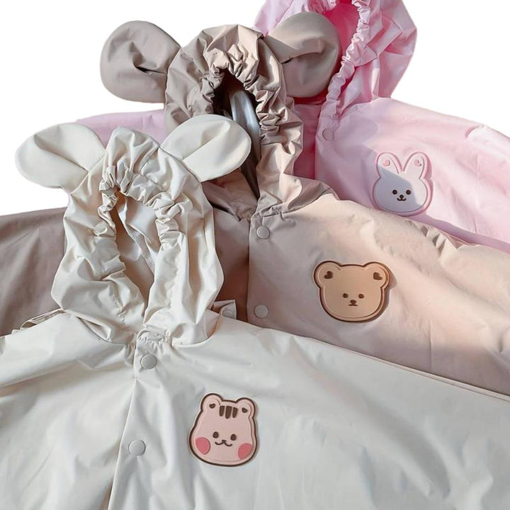 Vibrant cartoon print unisex raincoat for children. Waterproof outerwear ensures kids stay dry during outdoor play.