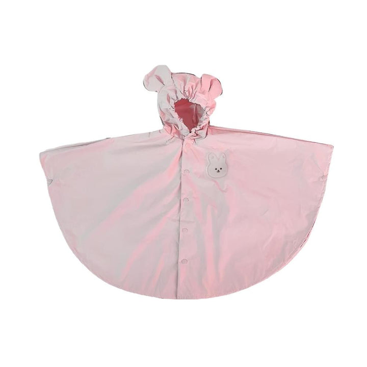 Happy child wearing a cute waterproof unisex raincoat. All-season rain gear for toddlers, keeping them dry & stylish.