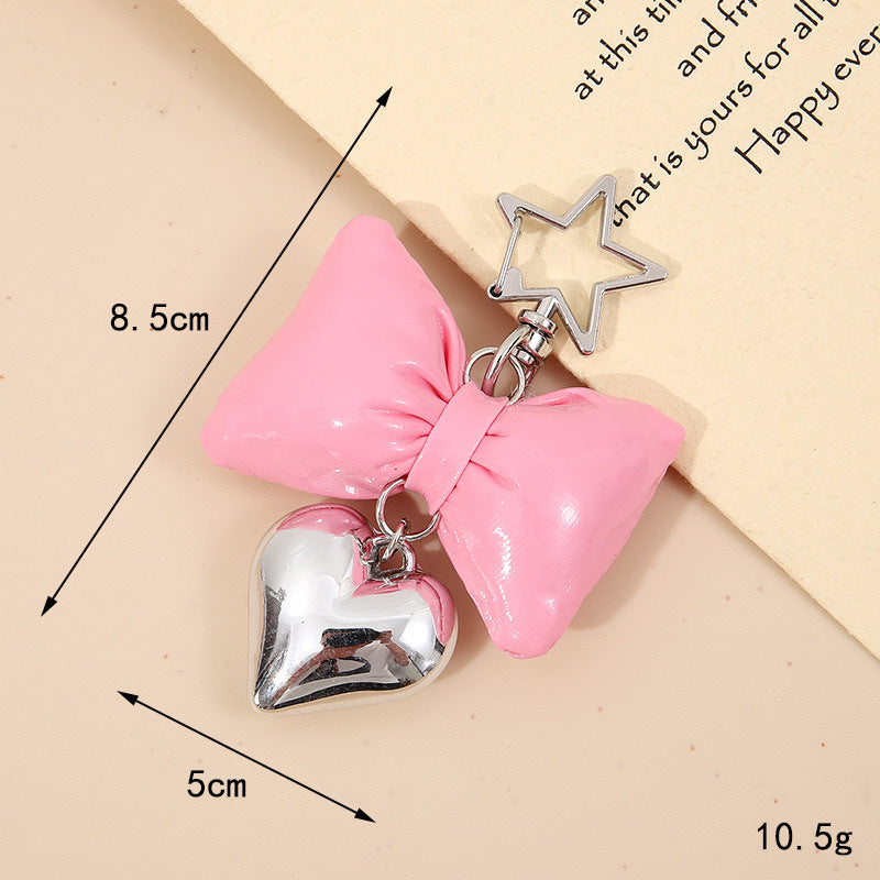 Shiny gold bow & heart keychain. Cute bag accessory & key holder for women's gifts.