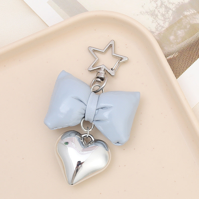 Cute women's bow & heart keychain. Stylish bag accessory, purse charm, and key holder.