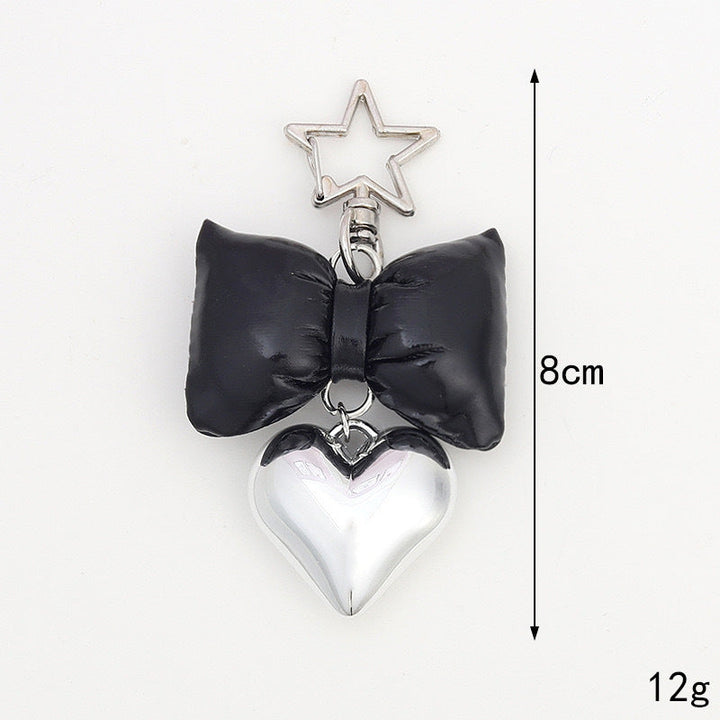 Adorable pink bow keychain with heart charm. Trendy bag accessory & key holder for women's purses.