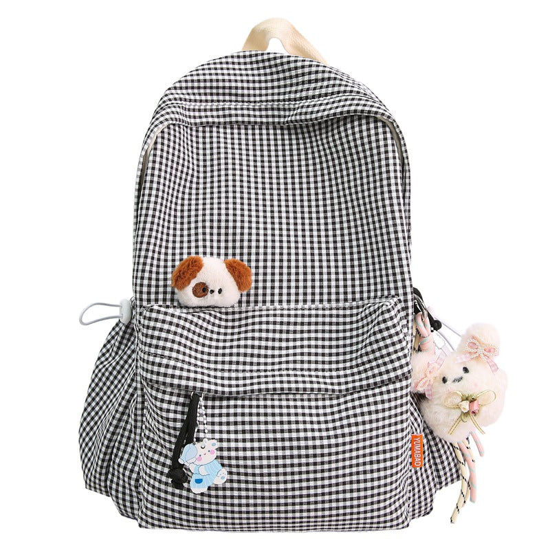 Stylish women's checked backpack, versatile for travel, work, or daily use. Features a cute design.