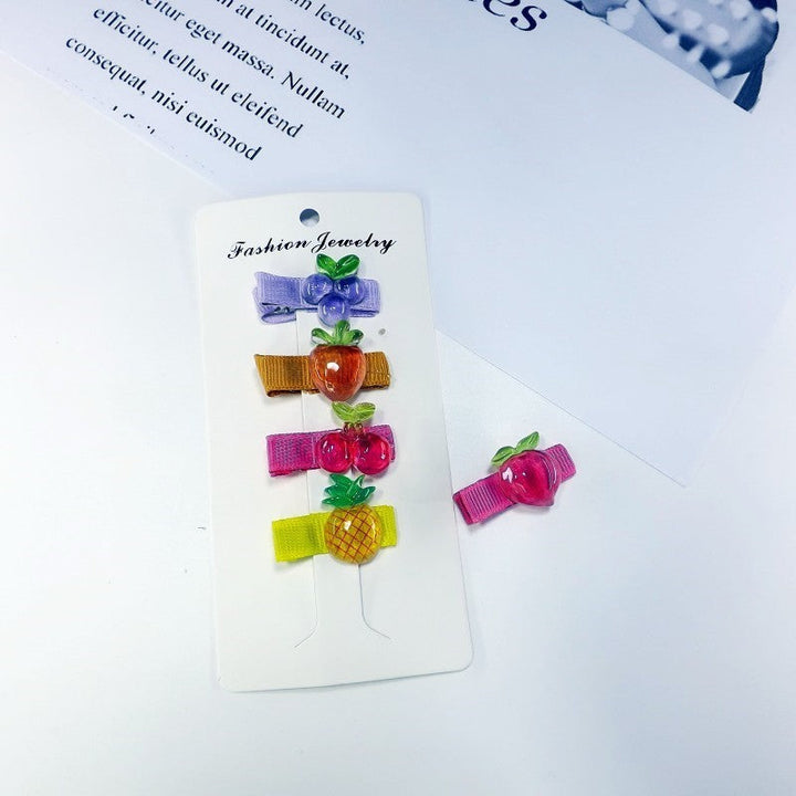 Set of playful fruit and Mickey Mouse hair clips for women. Cute & stylish hairpins, perfect hair accessories.