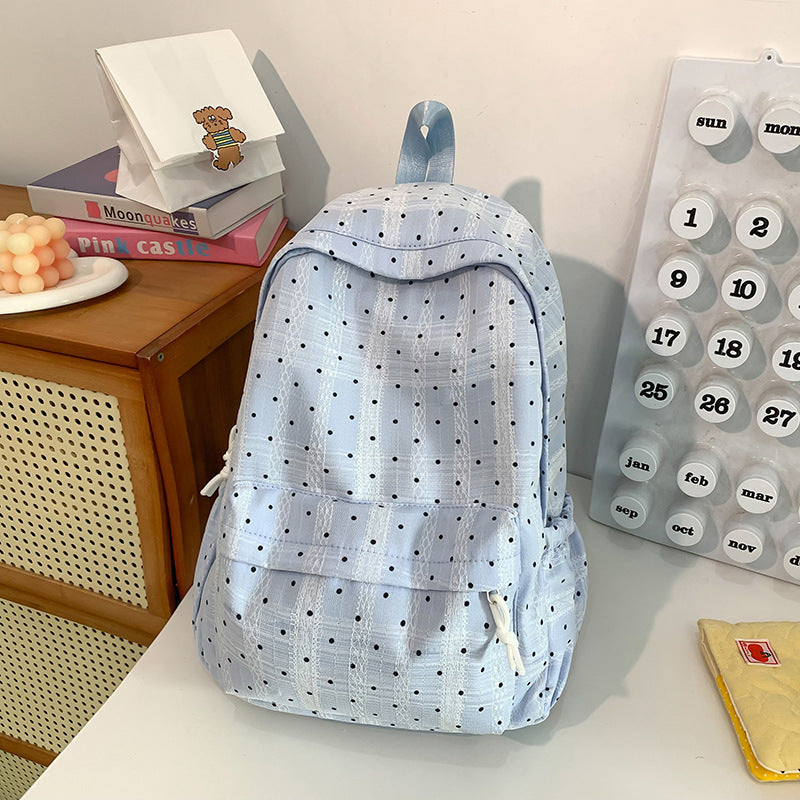 Durable blue polka dot travel backpack for women. Perfect cute casual bag for daily use or short trips.