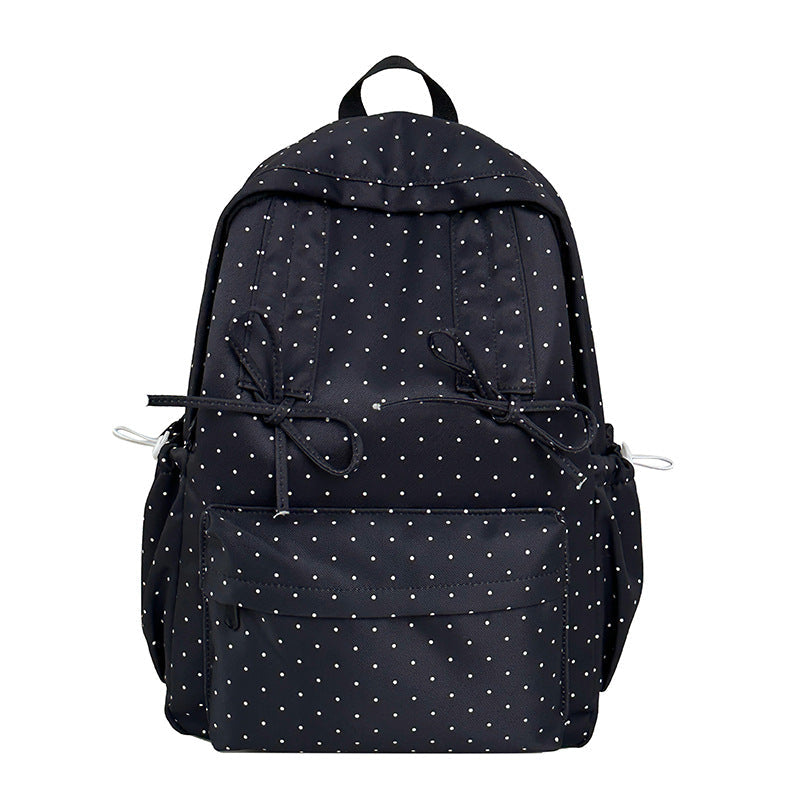 Stylish green polka dot women's backpack. Cute & durable bag, ideal for school, travel, or everyday fashion.