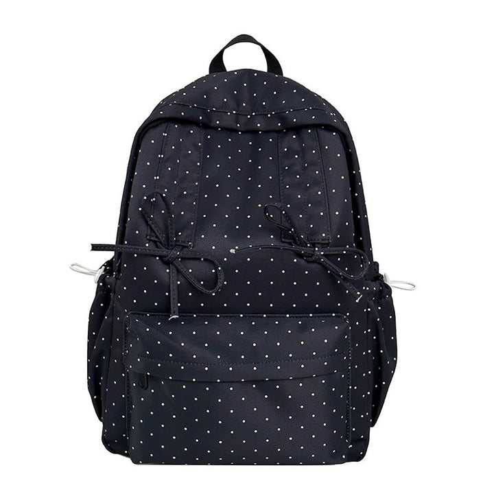 Stylish green polka dot women's backpack. Cute & durable bag, ideal for school, travel, or everyday fashion.