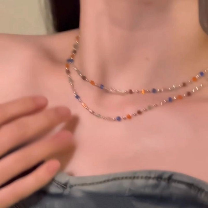 Elegant women's chain necklace featuring delicate multi-color beads, versatile accessory.