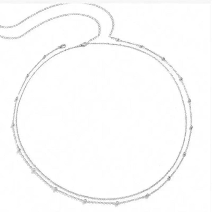 Fashionable minimalist layered chain necklace in gold, a delicate and elegant accessory for women's jewelry.