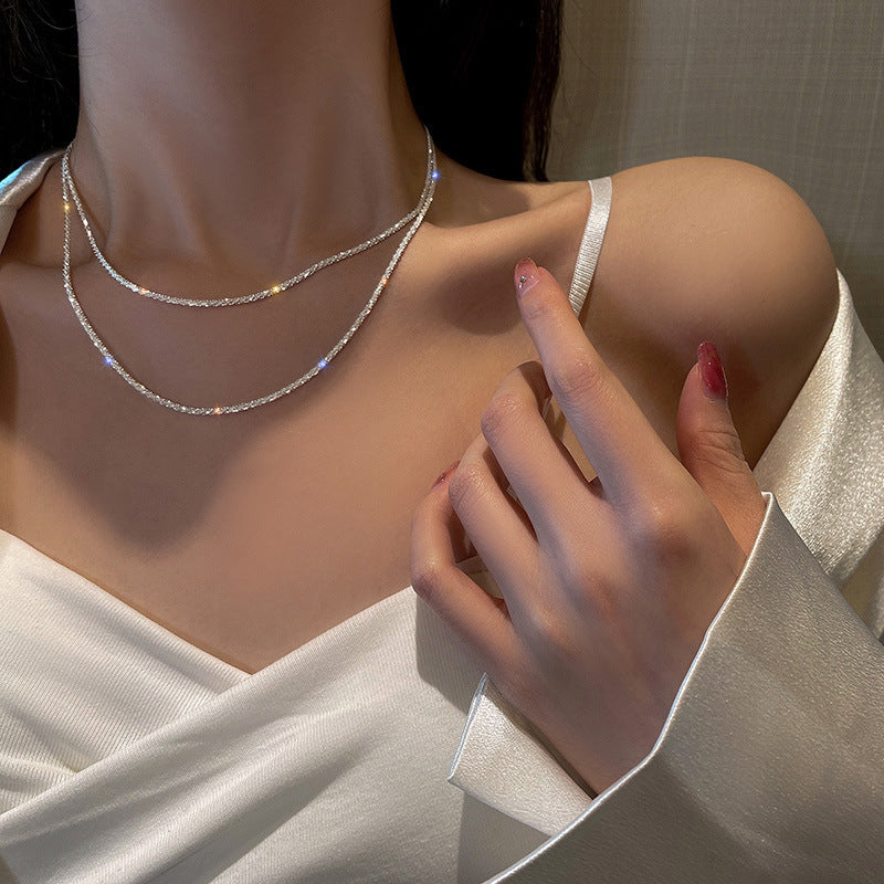 Dainty gold-tone textured chain necklace & matching bracelet set for women. Elegant, minimalist jewelry accessory.